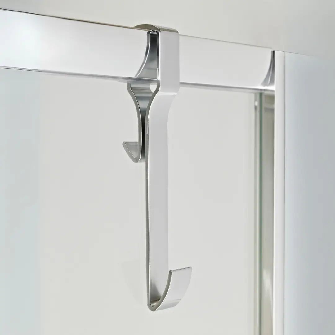 Chrome enclosure hook supporting framed shower glass in a modern wetroom, offering stability and style – DDL Tiles