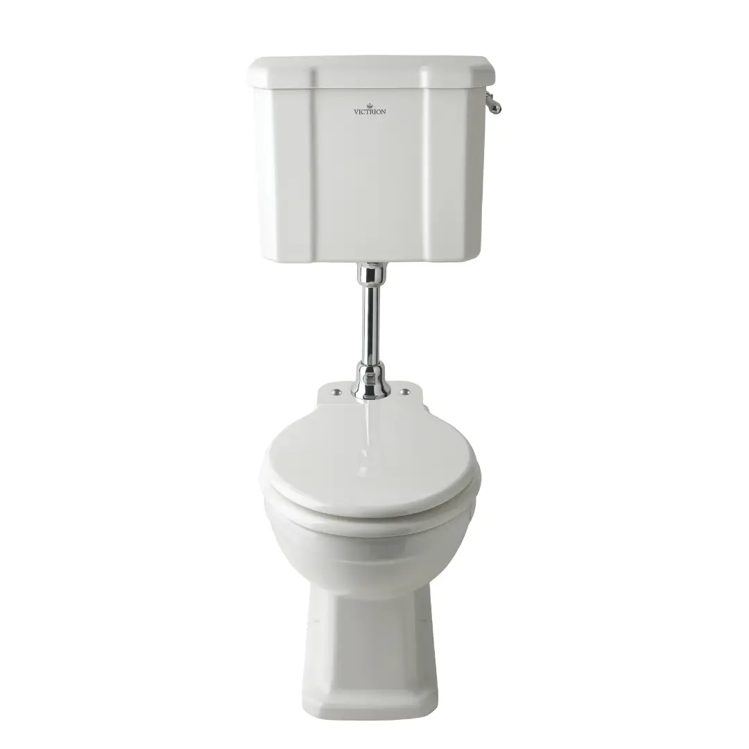 Low-level traditional cistern with chrome lever in vintage bathroom interior, space-saving and elegant – DDL Tiles