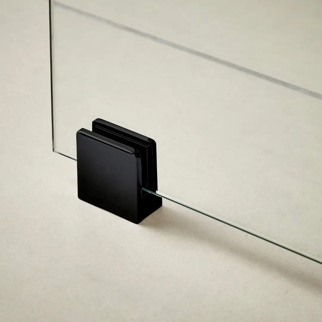 Black wall bracket and support foot securing wetroom screen for strong alignment and modern utility – DDL Tiles