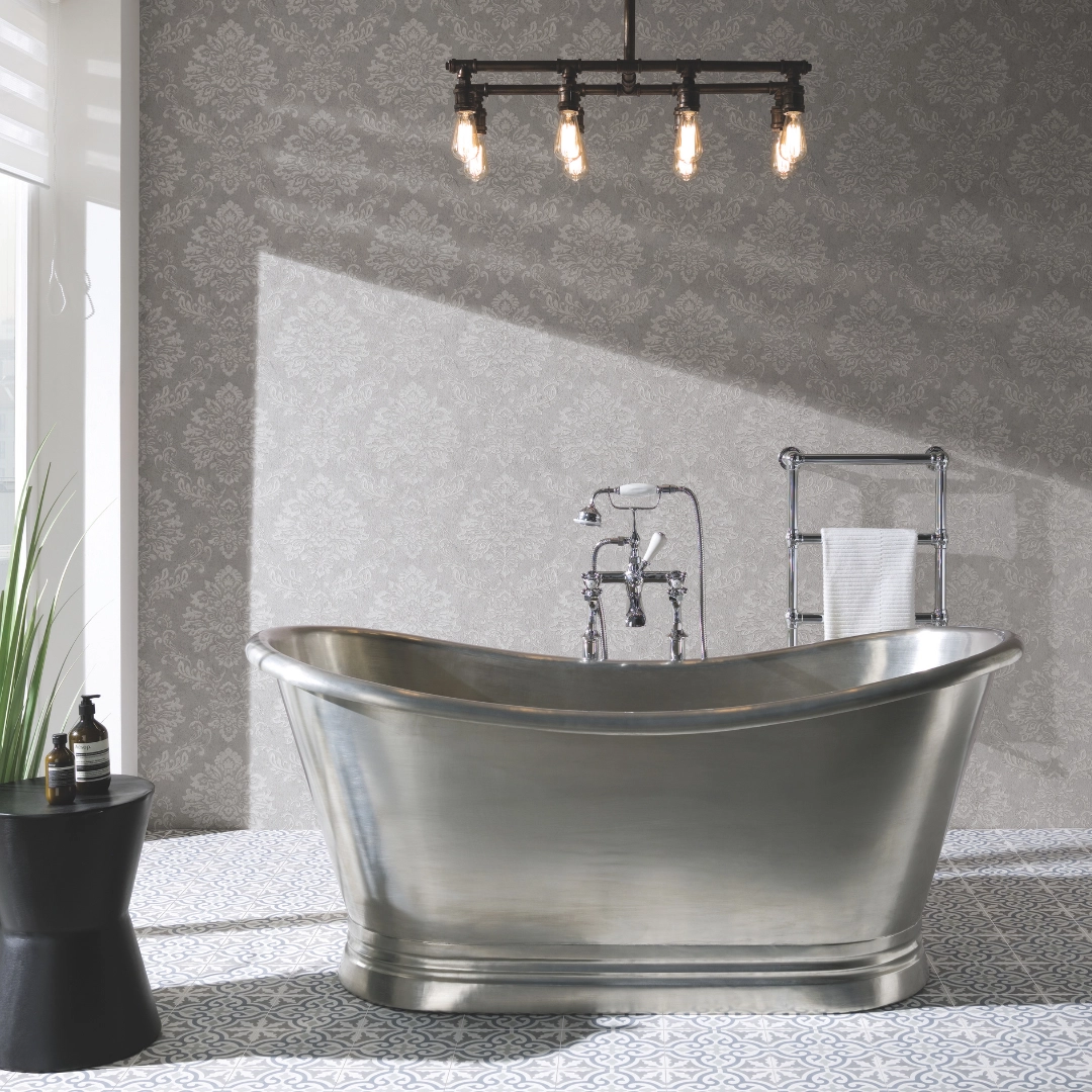 Freestanding matte tin bath with soft curves placed in a serene, elegant bathroom interior – perfect for luxury – DDL Tiles