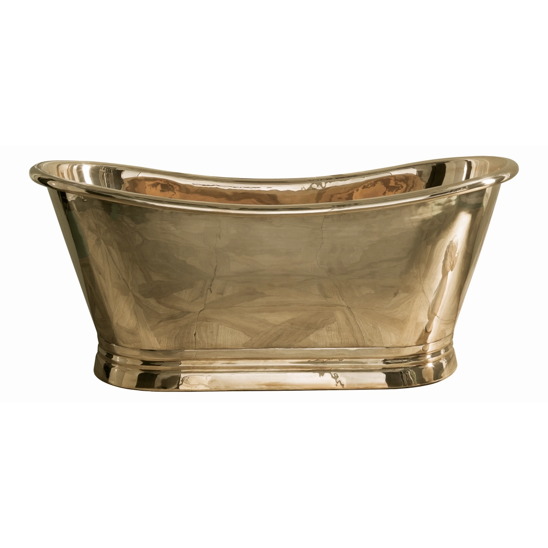 Freestanding bath in warm brass finish glowing in a serene, softly lit modern bathroom interior – DDL Tiles