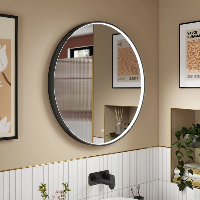 Inset chrome LED mirror with sleek frame and touch sensor glowing in a modern bathroom space – DDL Tiles