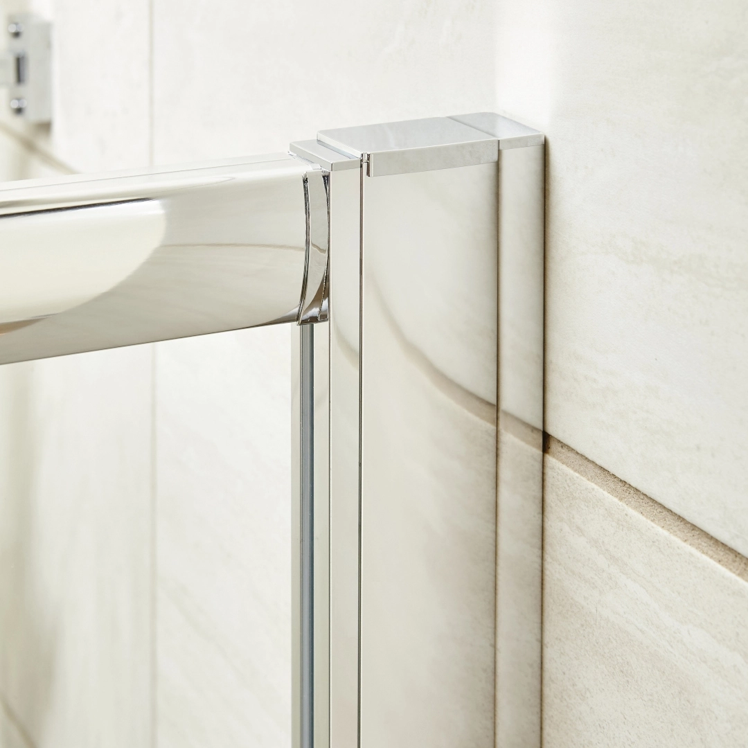 Chrome extension components laid out for shower enclosure adjustment in modern bathroom setting – DDL Tiles