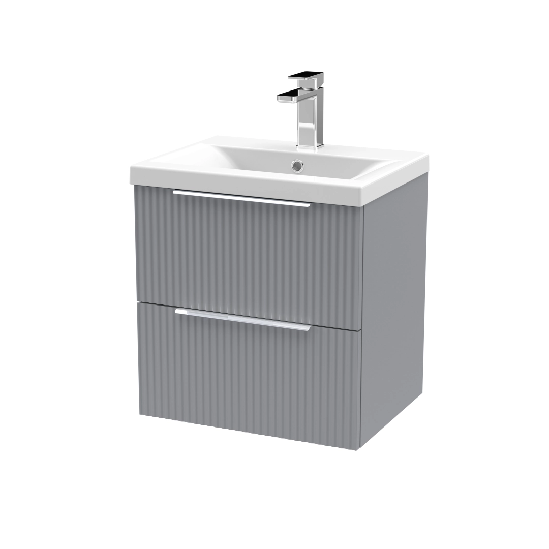 Wall-hung bathroom vanity with ripple design and grey drawers in a warm, modern setting – DDL Tiles